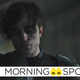 Robert Pattinson's Bruce Wayne removes his mask in a scene from The Batman.